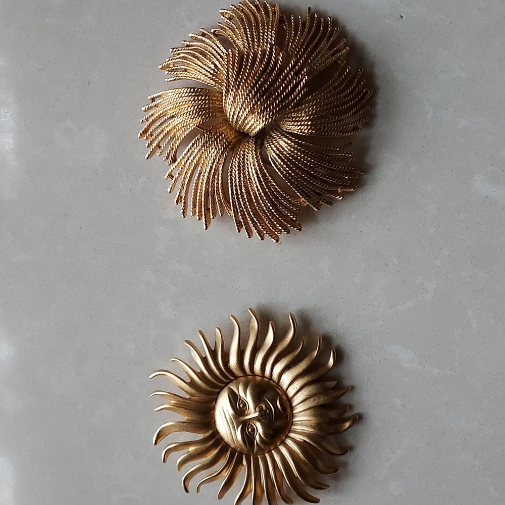 Two Monet brooches